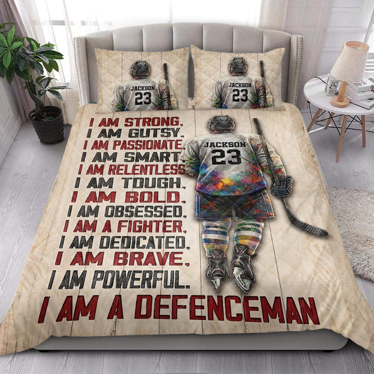 Hockey quilt bedding styled in a bright bedroom with hockey player artwork and bold motivational lettering
