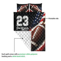 Football quilt showing the printed front and white quilted reverse in a product detail view