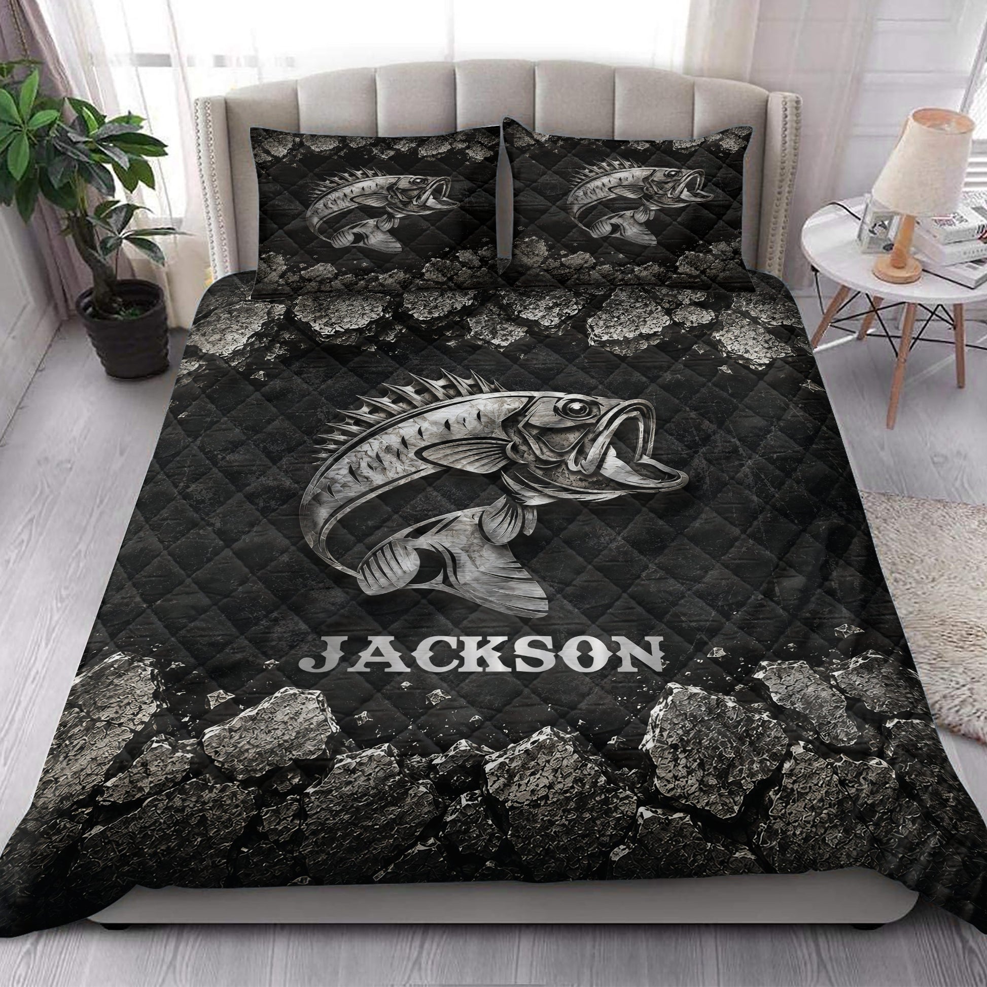 Fishing quilt blanket styled in a bedroom with a large bass illustration and dark rocky landscape