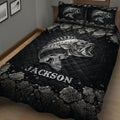 Close bedroom view of a black bass fishing quilt blanket with silver fish and stone artwork