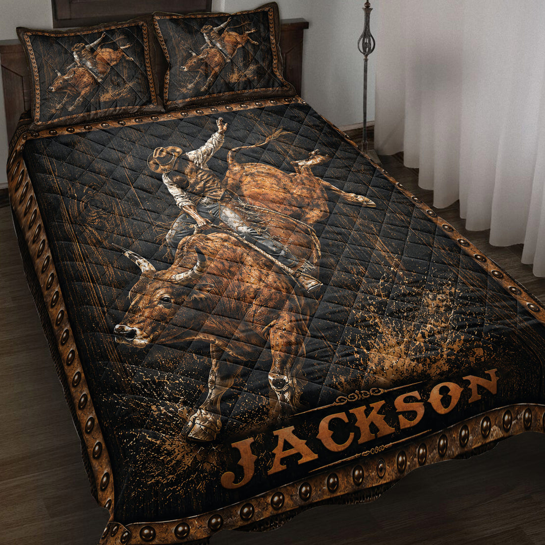 Rodeo quilt blanket featuring a bull rider on a bucking bull with rustic black and bronze western artwork