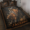 Rodeo quilt blanket featuring a bull rider on a bucking bull with rustic black and bronze western artwork