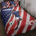Soccer quilt blanket bedding set displayed on a bed with red, white, and blue player artwork