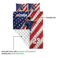 Soccer quilt blanket showing the printed front and white quilted reverse