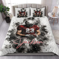 Football quilt blanket styled in a bedroom with bold red and black player artwork across the bed