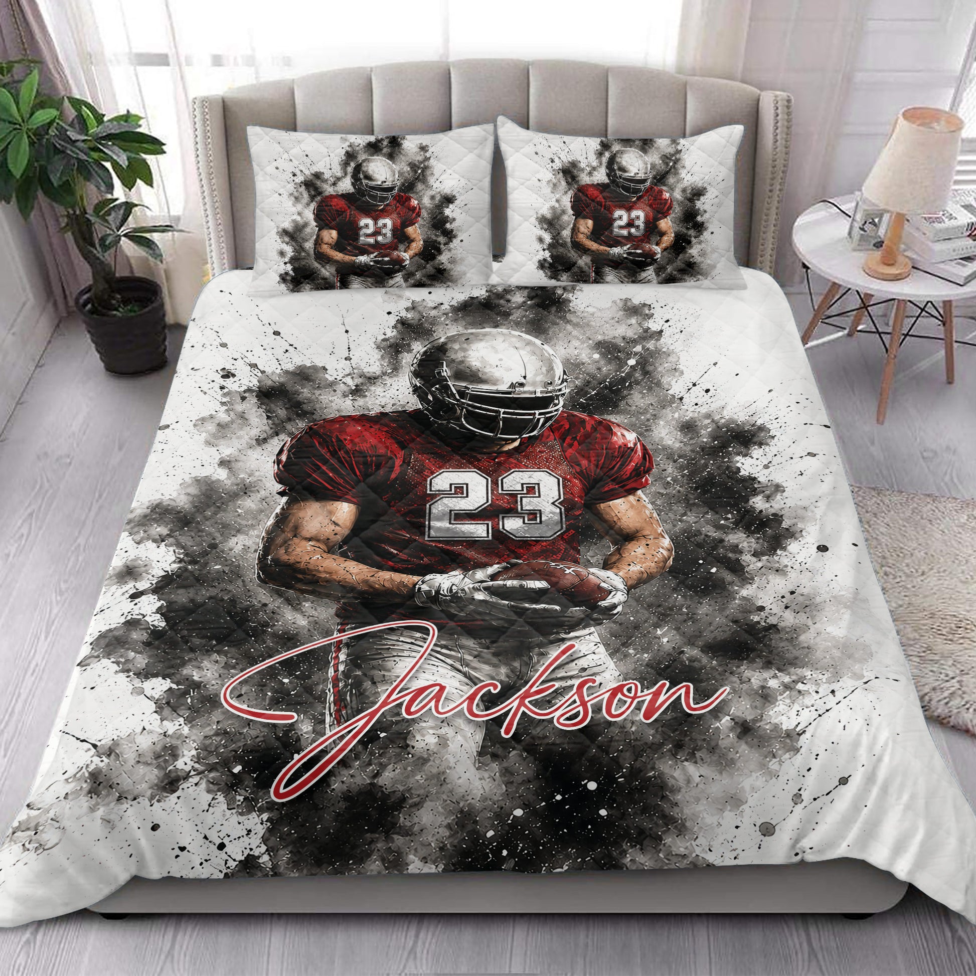 Football quilt blanket styled in a bedroom with bold red and black player artwork across the bed