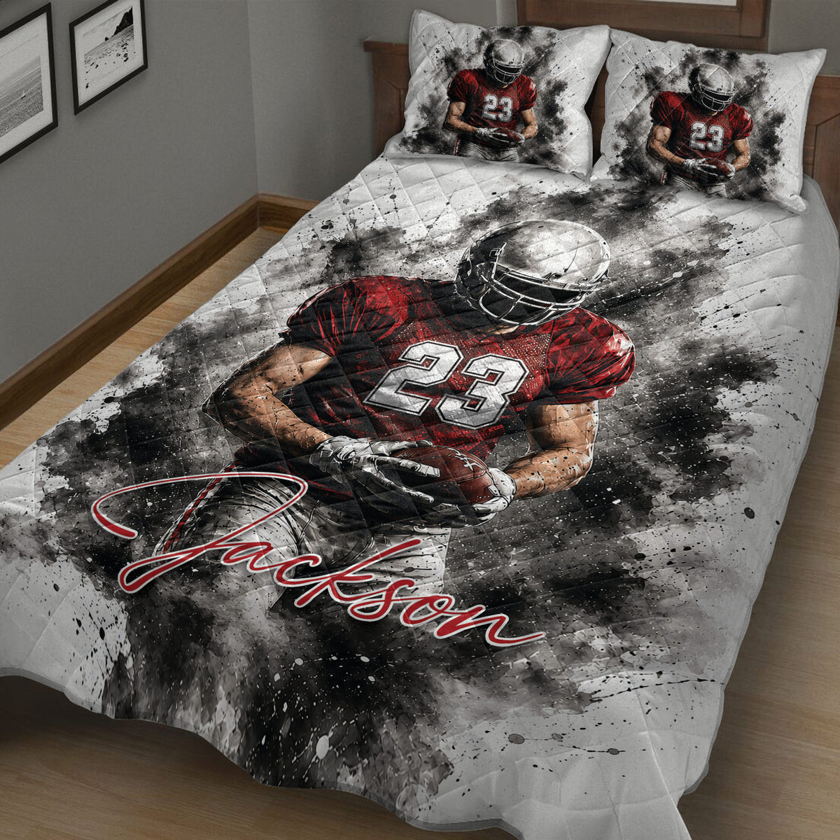 Close bedroom view of a football quilt blanket with dramatic player artwork and red, black, and white colors