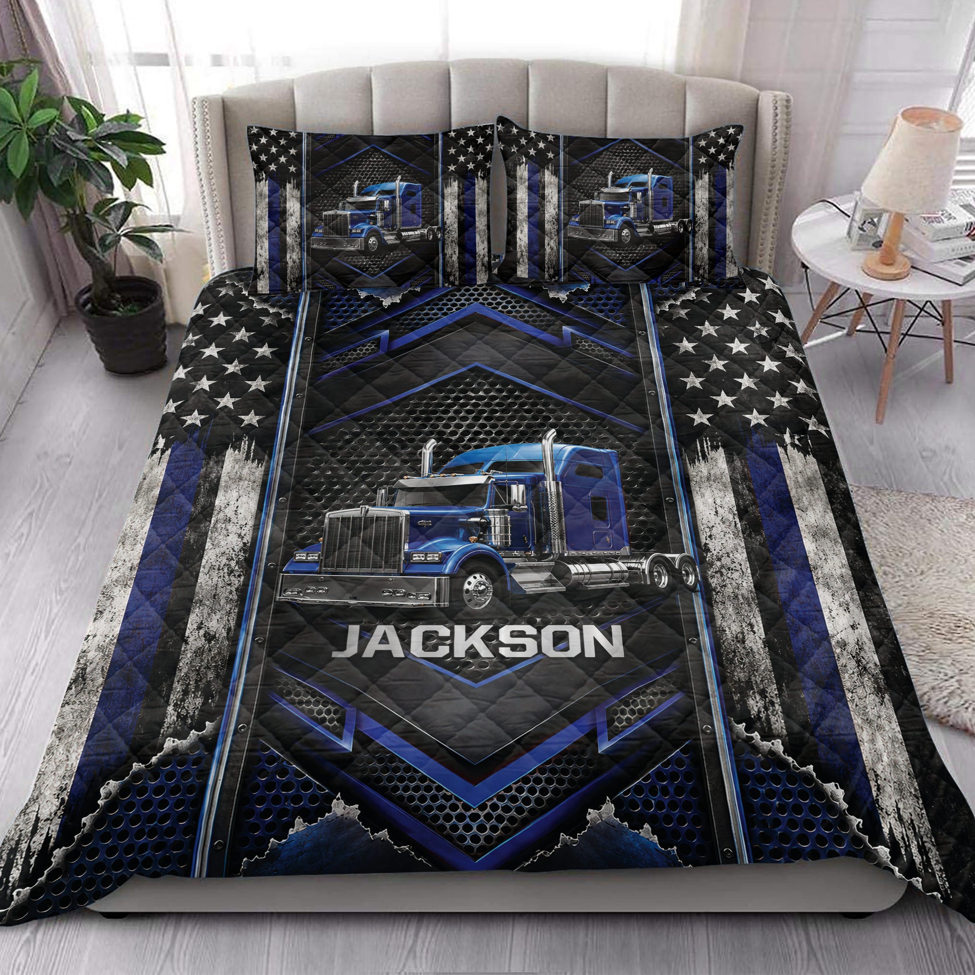 Trucker quilt blanket styled in a bedroom with bold blue semi-truck and industrial graphic artwork