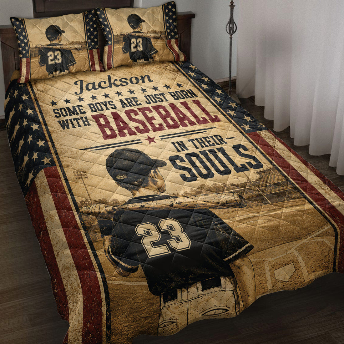 Baseball quilt blanket displayed on a bed with player artwork, stars, bats, and vintage patriotic colors