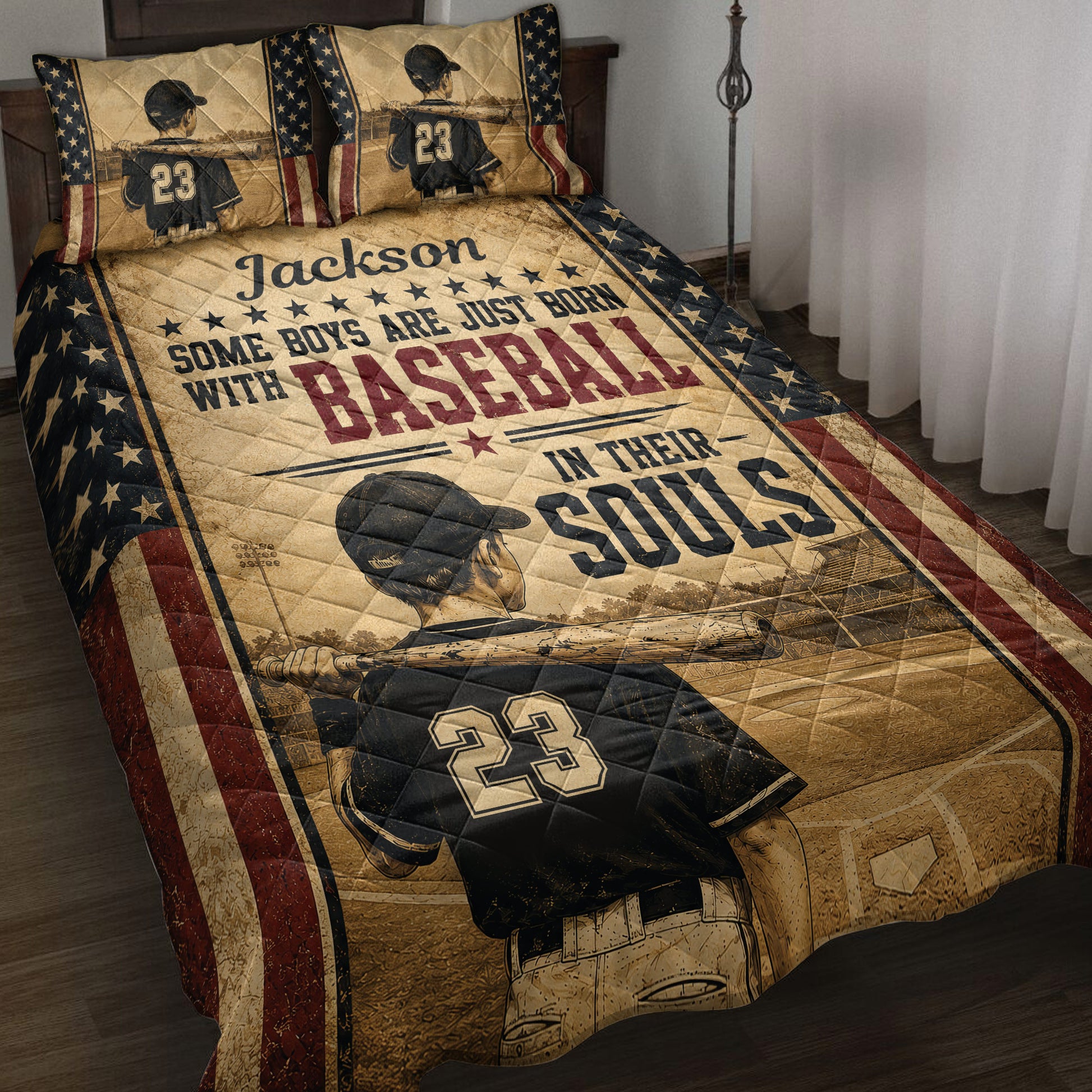 Baseball quilt blanket displayed on a bed with player artwork, stars, bats, and vintage patriotic colors