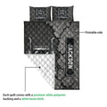 Close detail of trucker quilt showing printed semi truck artwork and white quilted backing