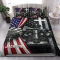 Firefighter quilt blanket styled on a bedroom bed with bold red, white, blue, and black artwork