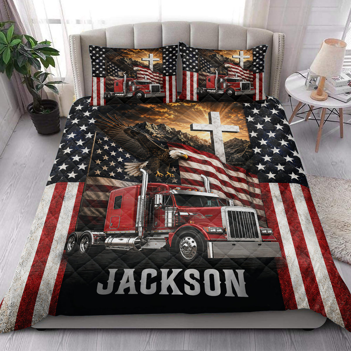 Patriotic trucker quilt blanket styled in a bedroom with red semi truck, eagle, stars, flag, and mountain artwork
