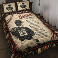 Baseball quilt blanket displayed on a bed with ballplayer artwork, baseballs, bats, gloves, and patriotic colors