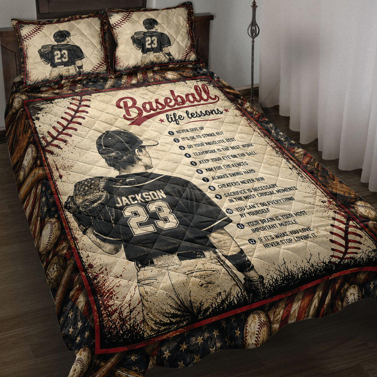 Baseball quilt blanket displayed on a bed with ballplayer artwork, baseballs, bats, gloves, and patriotic colors
