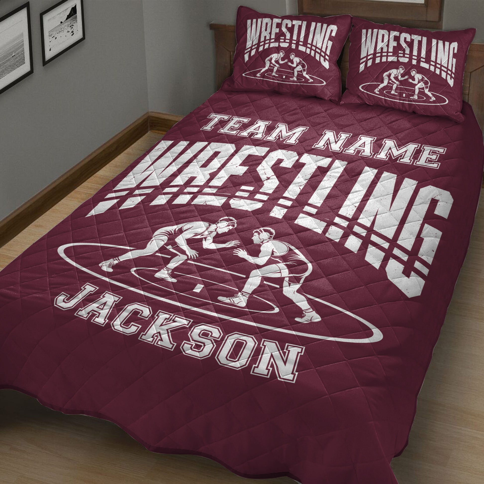 Maroon wrestling quilt blanket displayed on a bed with wrestlers and bold athletic artwork