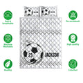 Soccer quilt bedding set shown front-facing with black and white ball graphics and quilted texture