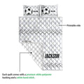 Soccer quilt blanket detail showing the printed side, quilted stitching, and bold geometric border