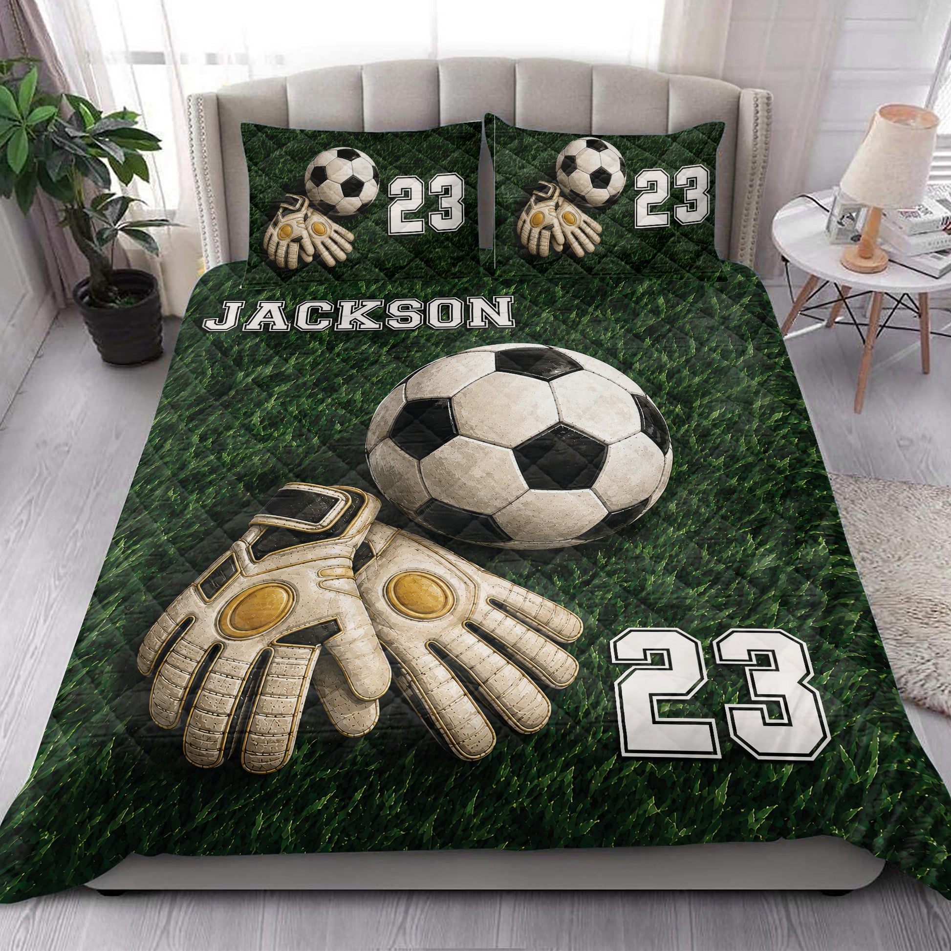 Soccer quilt blanket styled in a bedroom with large soccer ball and goalkeeper glove artwork