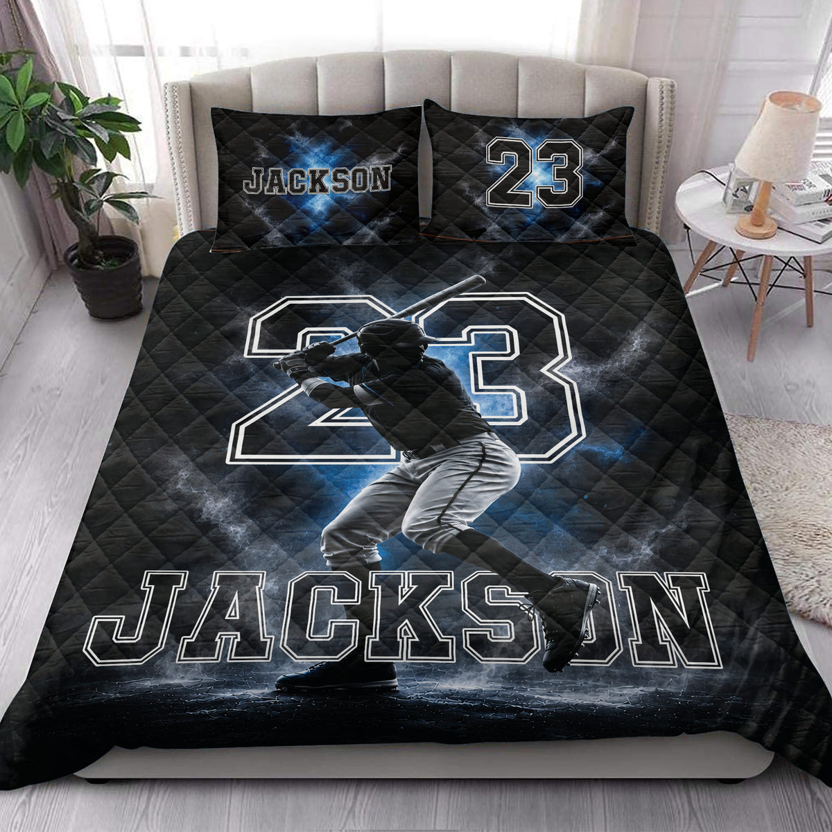 Baseball quilt blanket styled on a bedroom bed with dramatic batter artwork and blue highlights