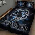 Close view of black baseball quilt blanket featuring a batting player and bold athletic artwork