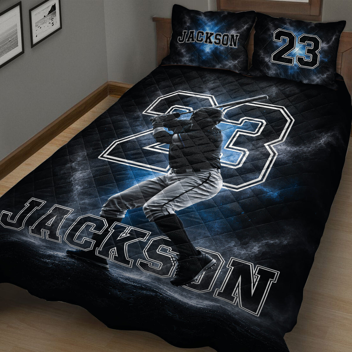 Close view of black baseball quilt blanket featuring a batting player and bold athletic artwork