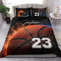 Basketball quilt bed set styled in a bright bedroom with dramatic orange, blue, and black sports artwork