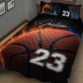 Close view of basketball quilt blanket with textured basketball artwork, hoop graphics, and bold athletic styling