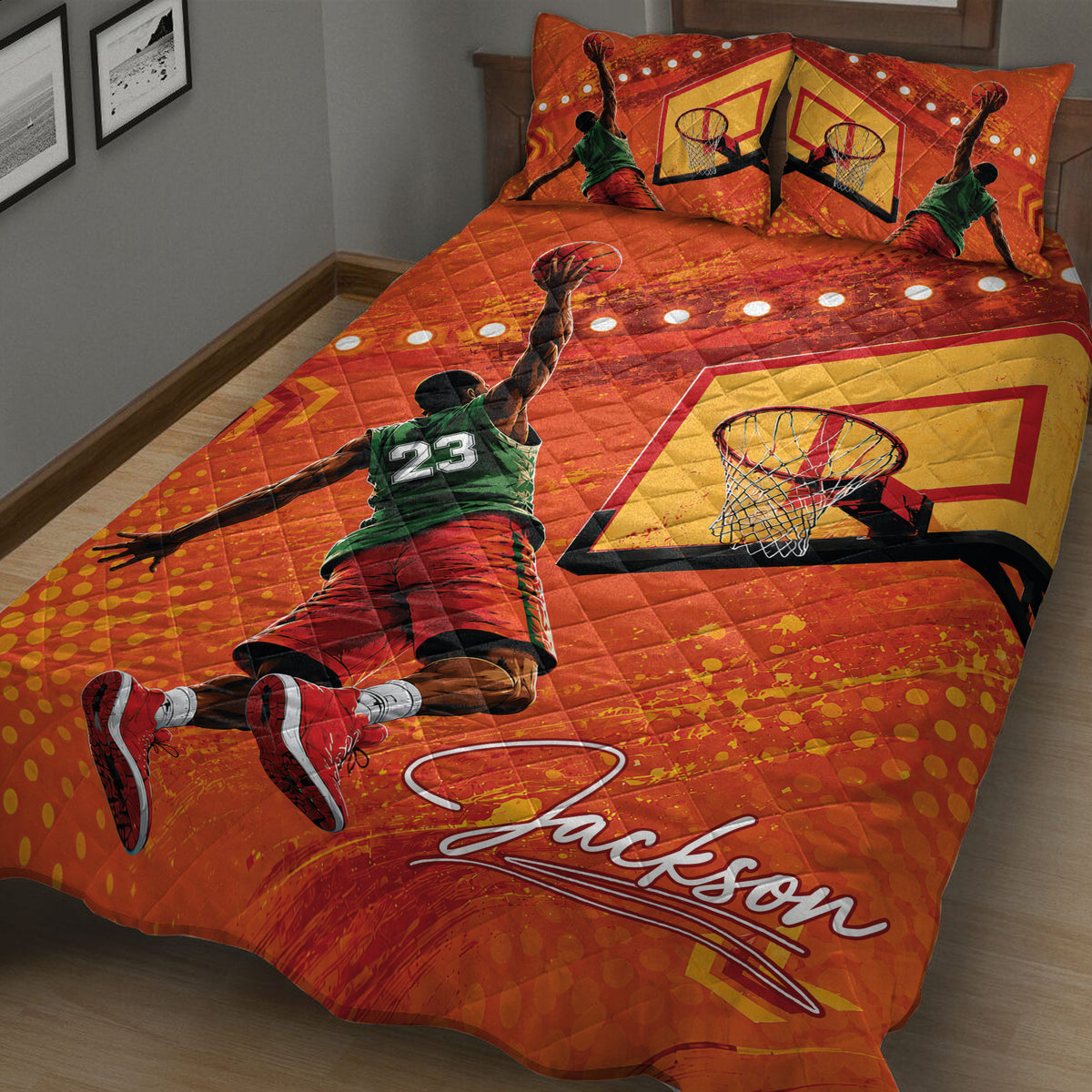 Close bedroom view of orange basketball quilt with player, hoop, and geometric graphics