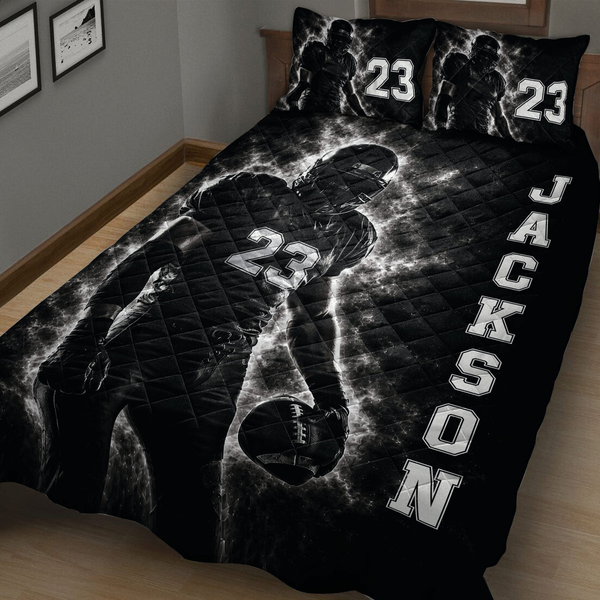 Close view of a football quilt featuring a helmeted player, oval football, and monochrome sports design