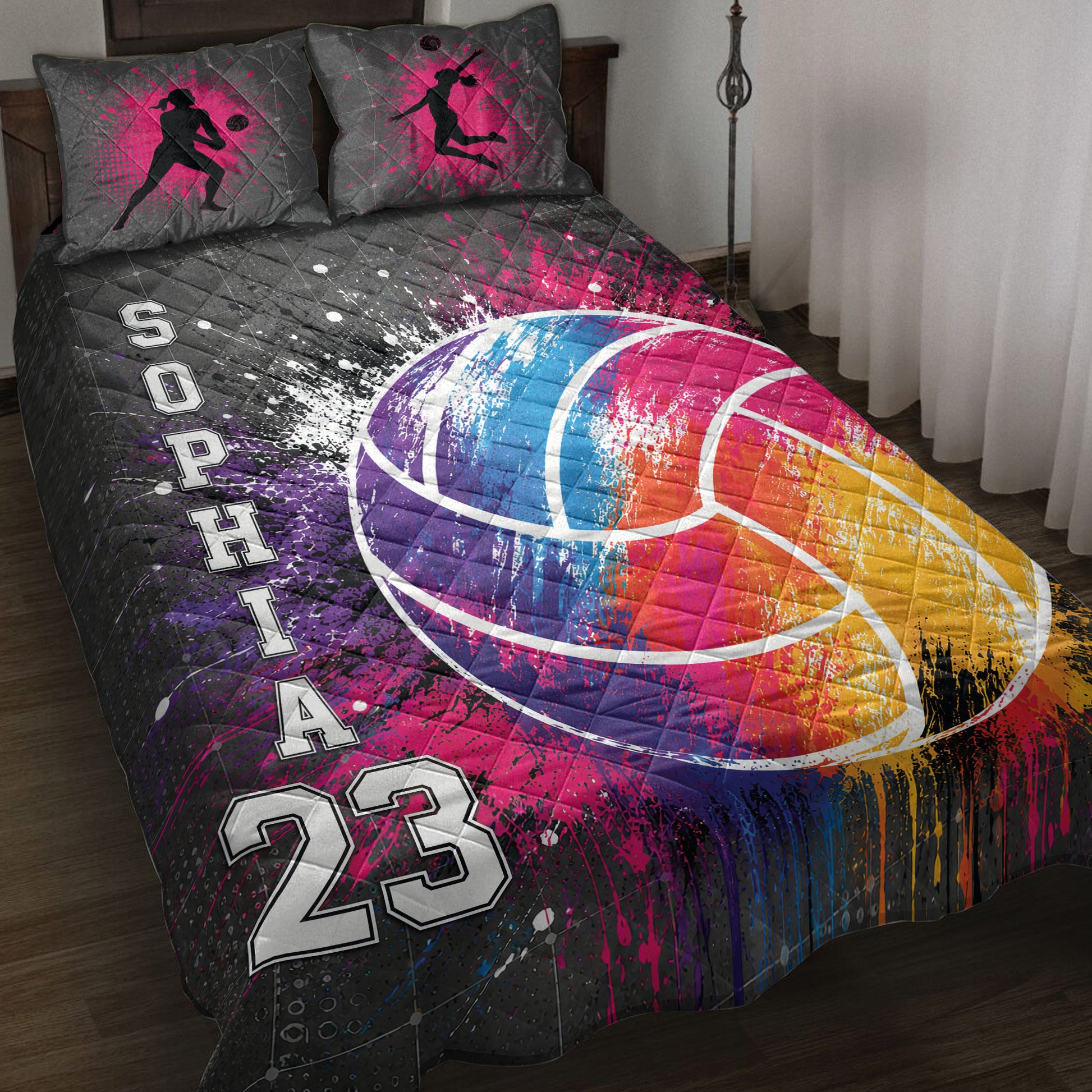 Volleyball quilt blanket on a bed with colorful paint-splash artwork and female player silhouettes