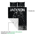 Football quilt showing a printed black front and white quilted reverse