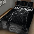Close bedroom view of a black football quilt with helmeted player design