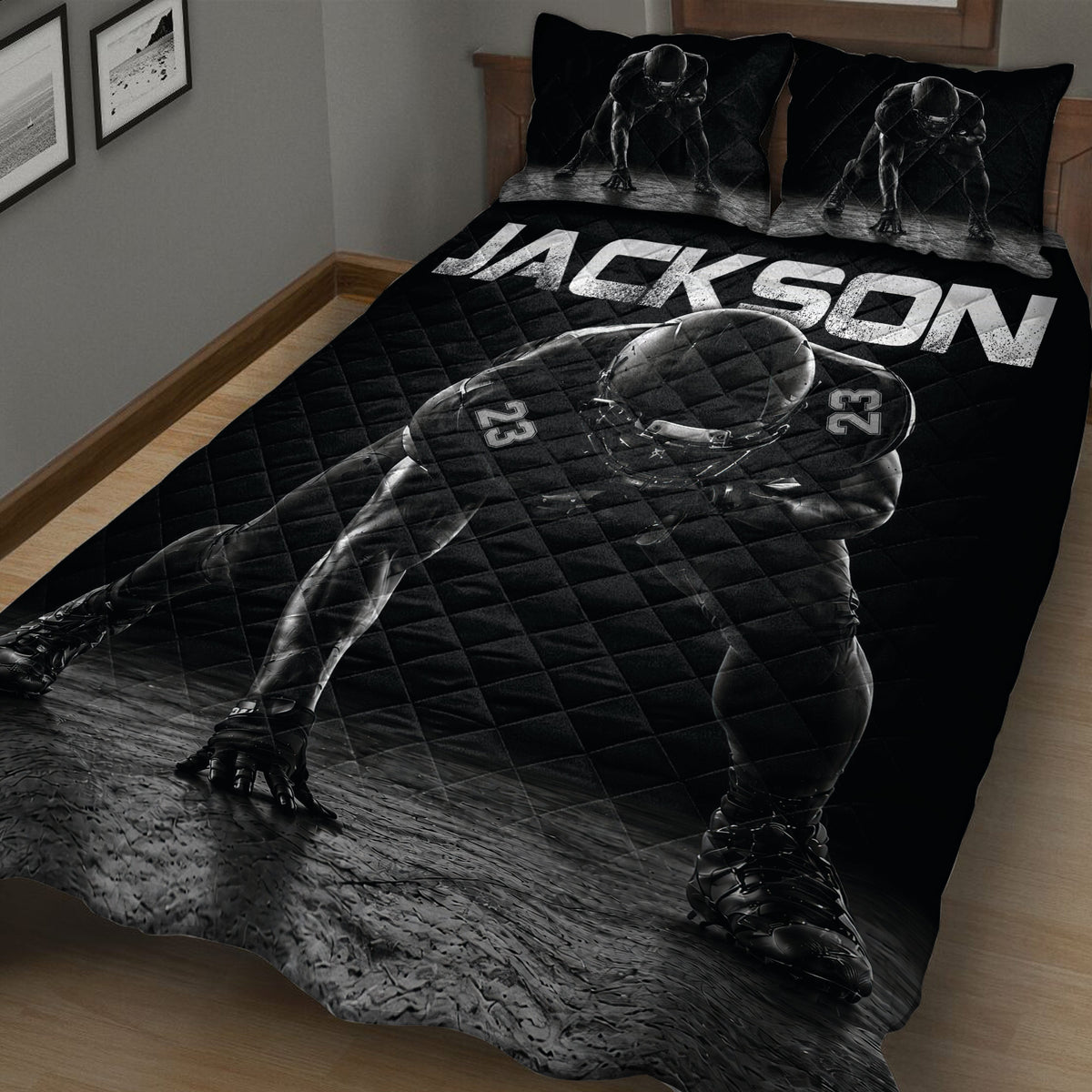 Close bedroom view of a black football quilt with helmeted player design