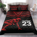 Black and red football quilt bedding styled in a bright bedroom with a helmeted player design
