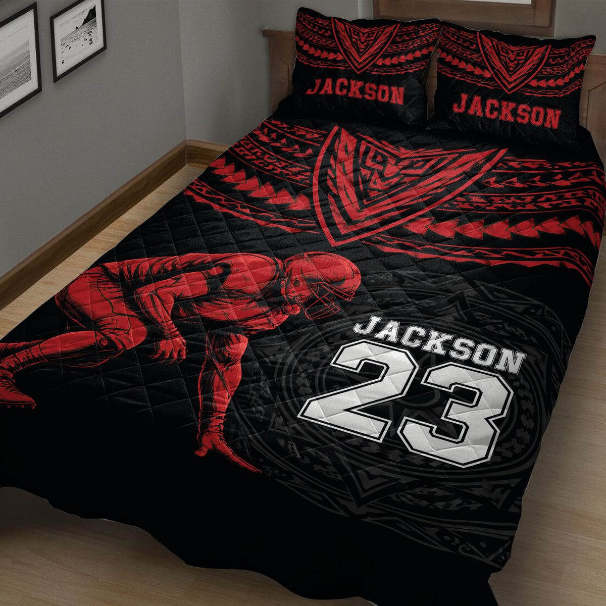 Close bedroom view of a black football quilt with red player artwork and bold jersey-inspired graphics