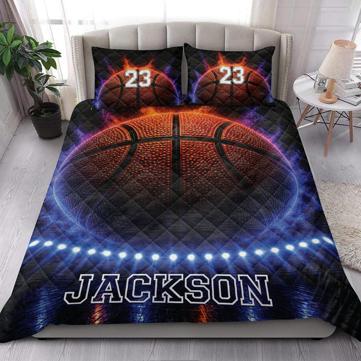 Basketball quilt blanket styled across a bedroom with bold orange, blue, and black artwork