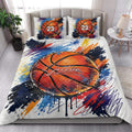 Basketball quilt blanket styled on a bedroom bed with bold colorful sports artwork