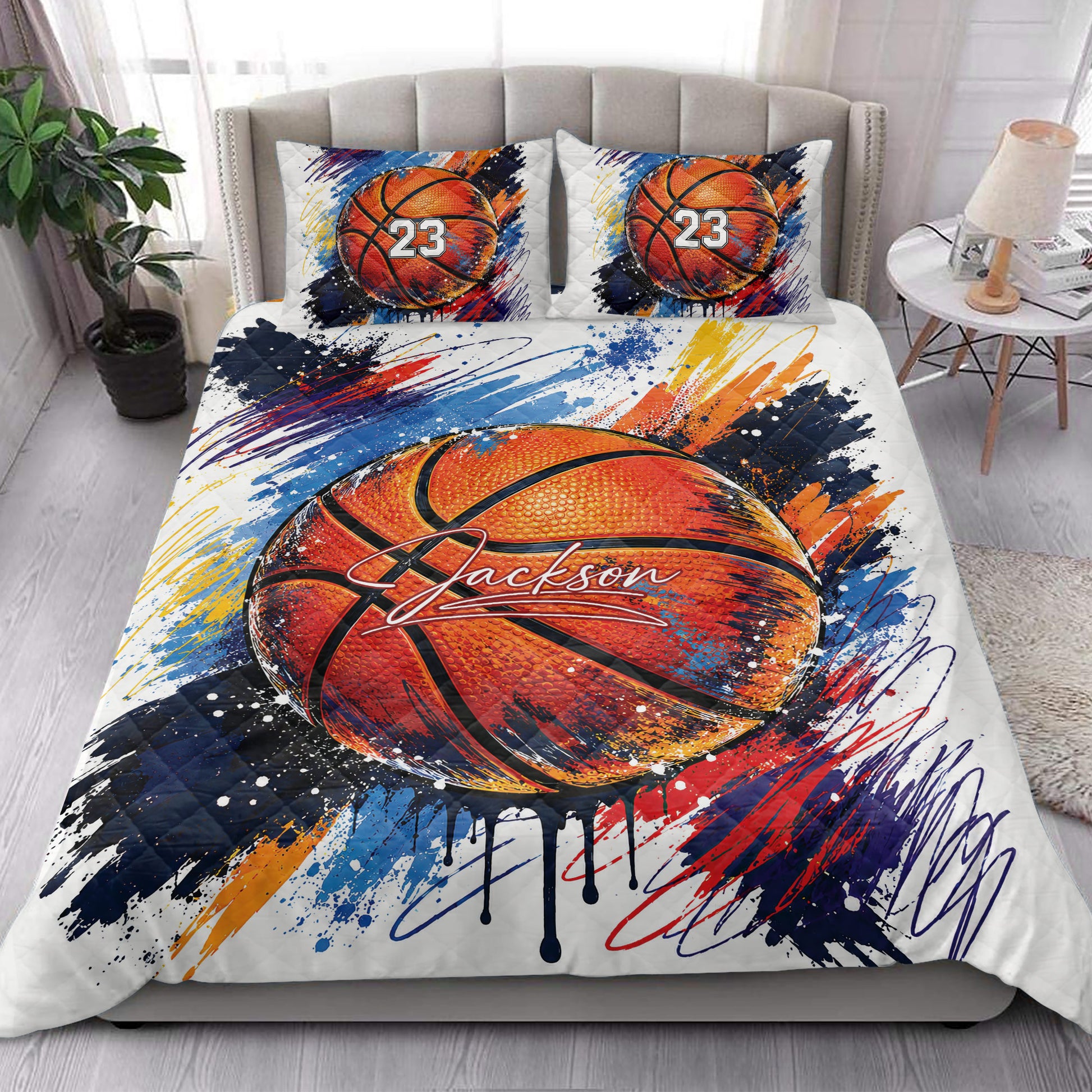 Basketball quilt blanket styled on a bedroom bed with bold colorful sports artwork