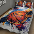 Close view of basketball quilt bedding with vivid paint-splatter graphics in a bedroom