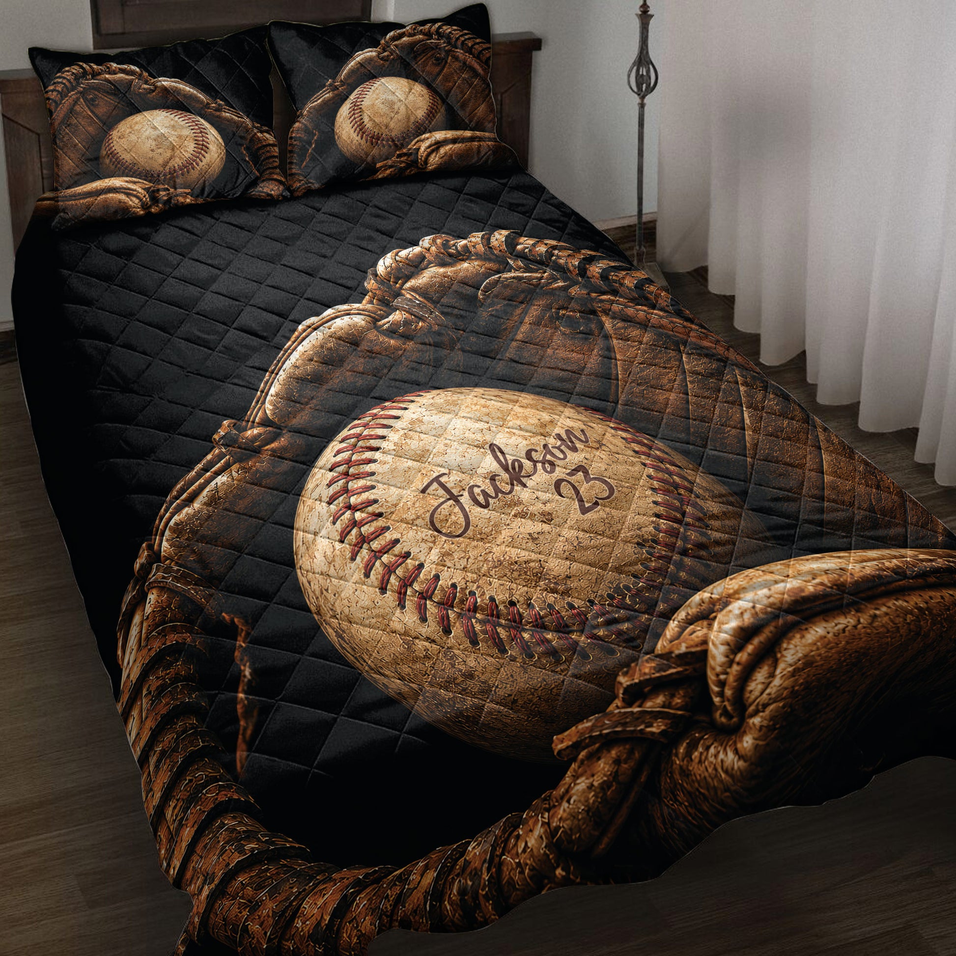 Baseball quilt blanket styled on a bed with vintage baseballs, gloves, and a black quilted background