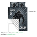 Football quilt blanket showing the printed front, white quilted backing, and sports player artwork