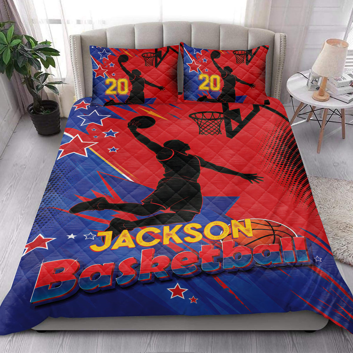 Basketball quilt bedding styled in a bright bedroom with red and blue player, hoop, and star graphics