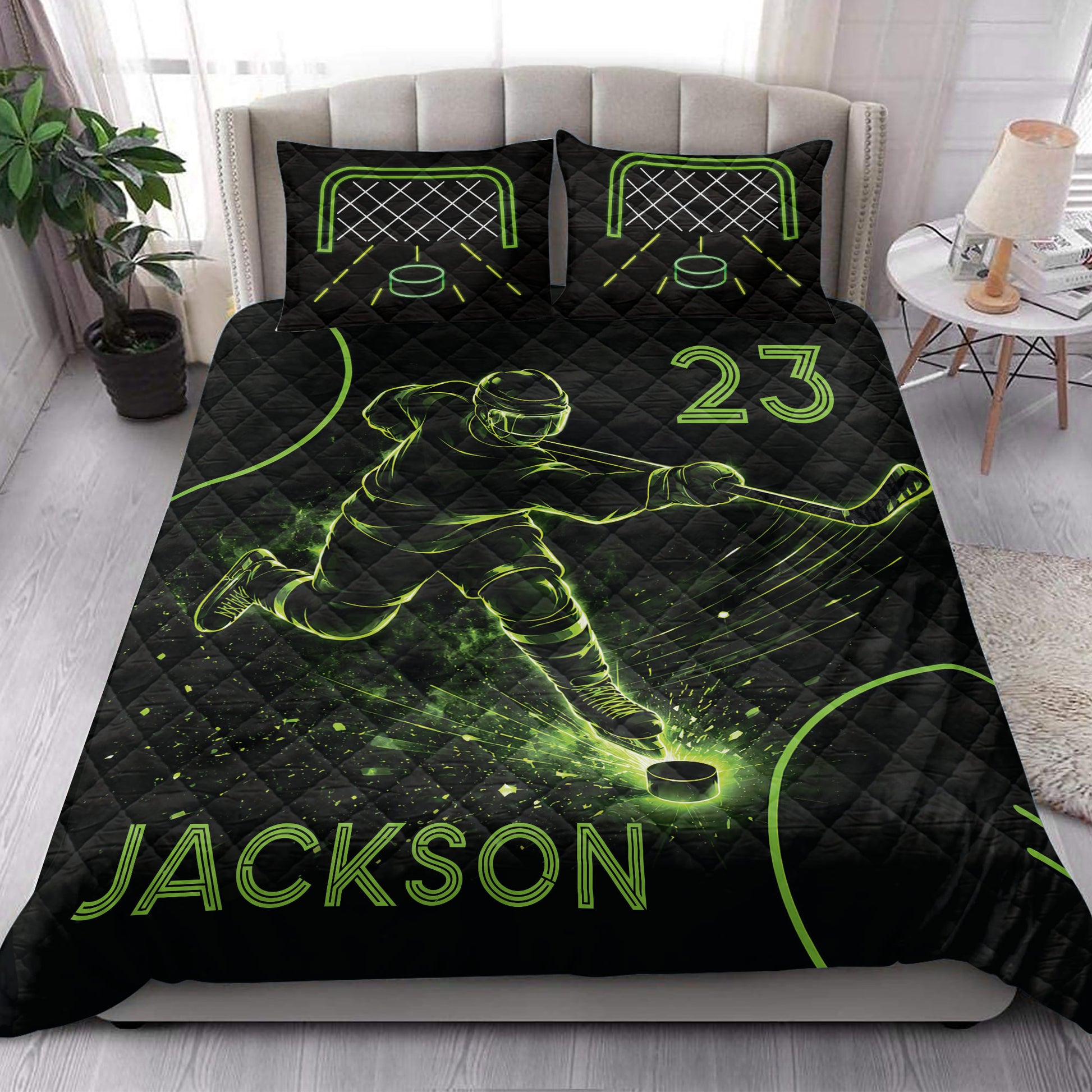 Hockey quilt bedding styled on a bedroom bed with black and neon green ice hockey artwork