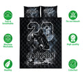 Black hockey quilt bedding set shown flat with an ice hockey player design and monochrome sports artwork