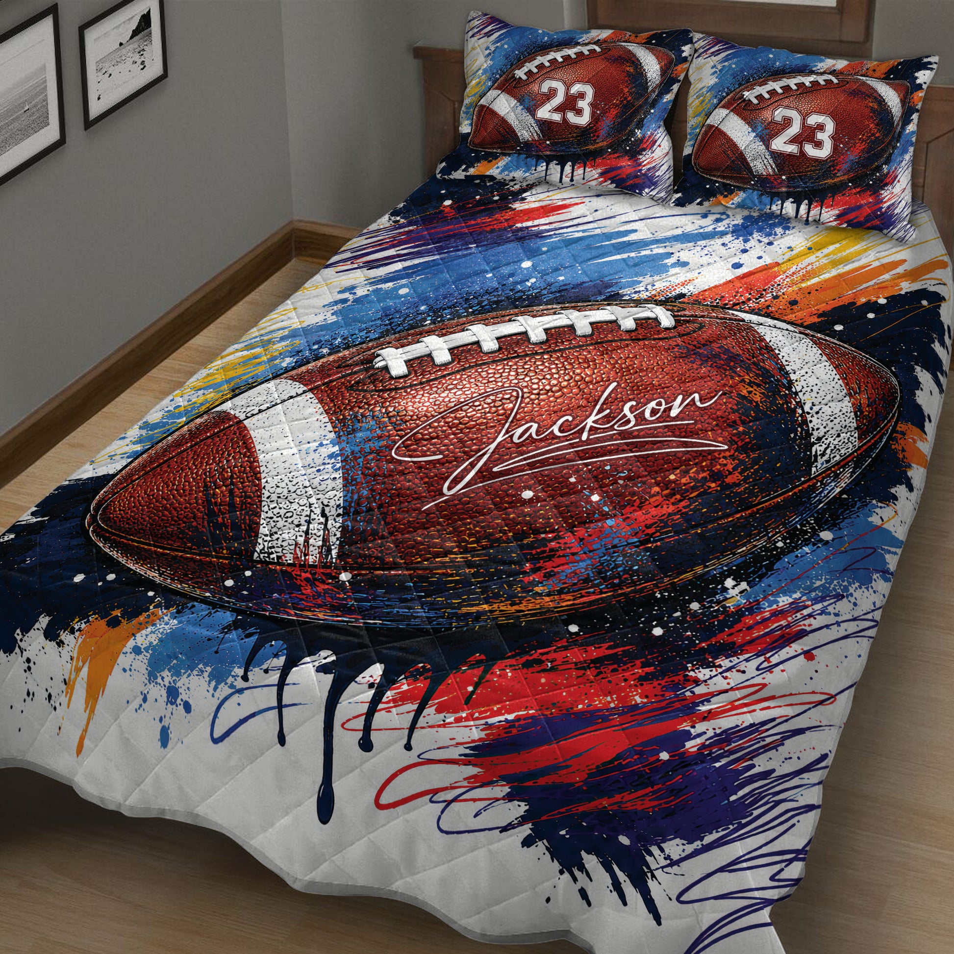 Close-up American football quilt blanket featuring a large textured football and energetic red, blue and orange artwork