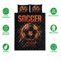Soccer quilt bedding set with black and orange ball artwork shown with product care icons