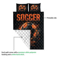 Soccer quilt showing the vibrant printable front and white quilted backing