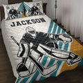 Hockey goalie quilt blanket bedding set displayed on a bed with teal and gold sports artwork