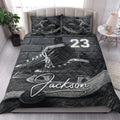 Ice hockey quilt bedding styled in a bright bedroom with dramatic skate and puck artwork